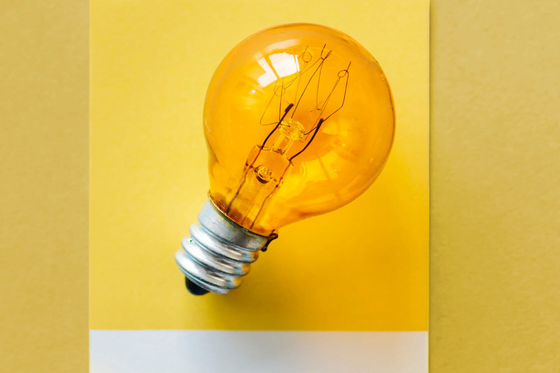 Picture of a bulb, links to AI page
