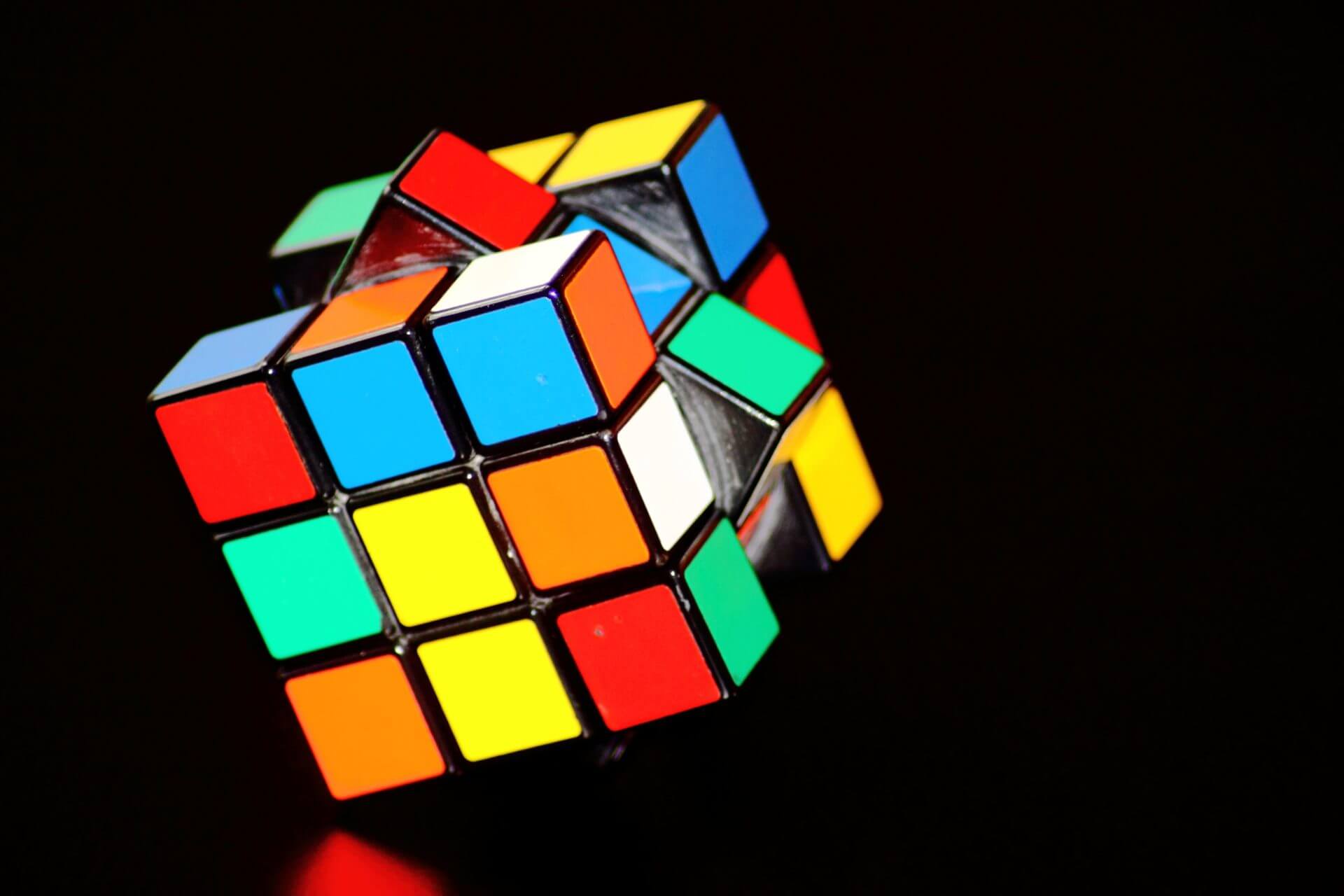 Picture of a colorful concentration cube, links to Theory research page